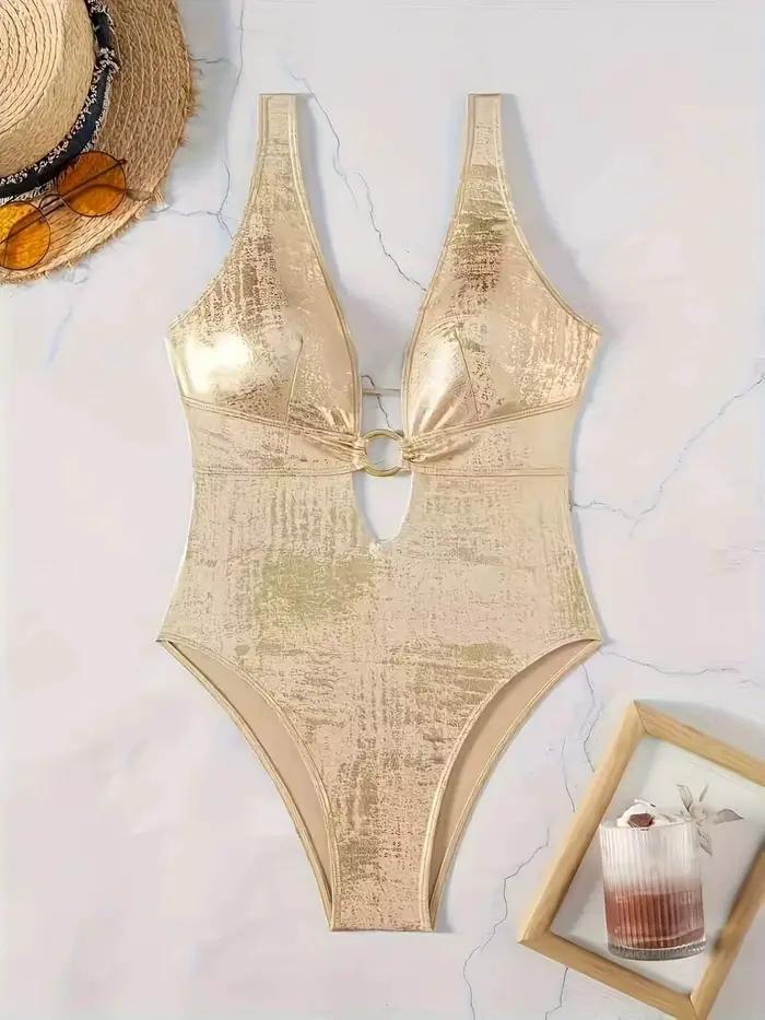 Maillot de bain une pièce doré métallisé brillant pour femme, décolleté en V profond, découpes avec 